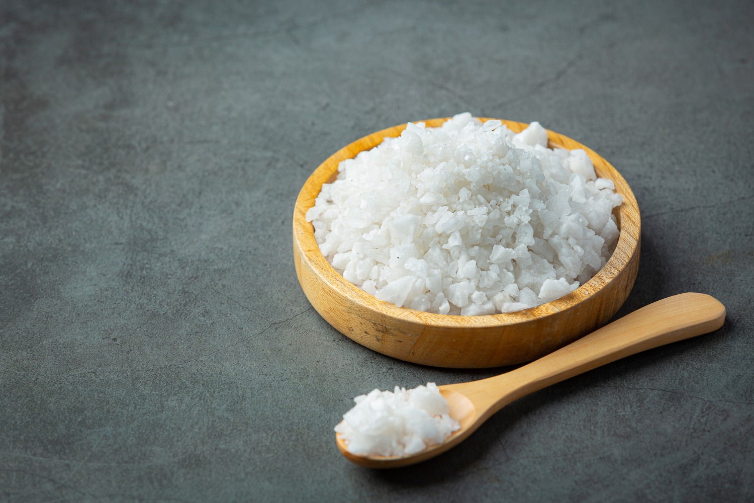 White caustic soda flakes in container